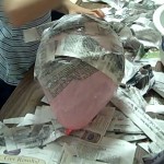 covering balloon with paper mache mush