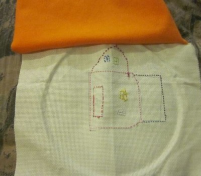 embroidered pillow  being sewn
