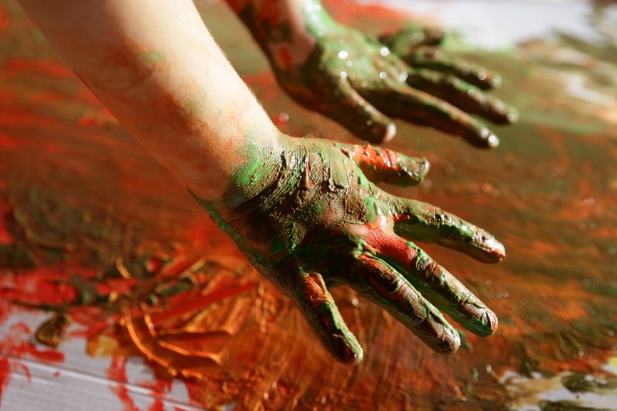 Children artist hands painting colorful